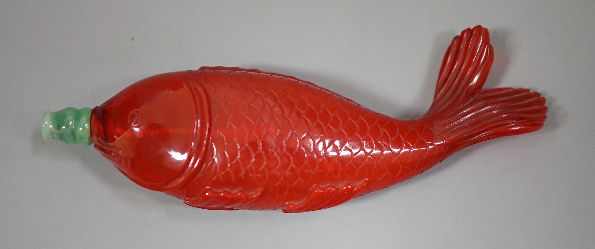 A Chinese moulded glass ‘fish’ snuff bottle, 11.5cm wide